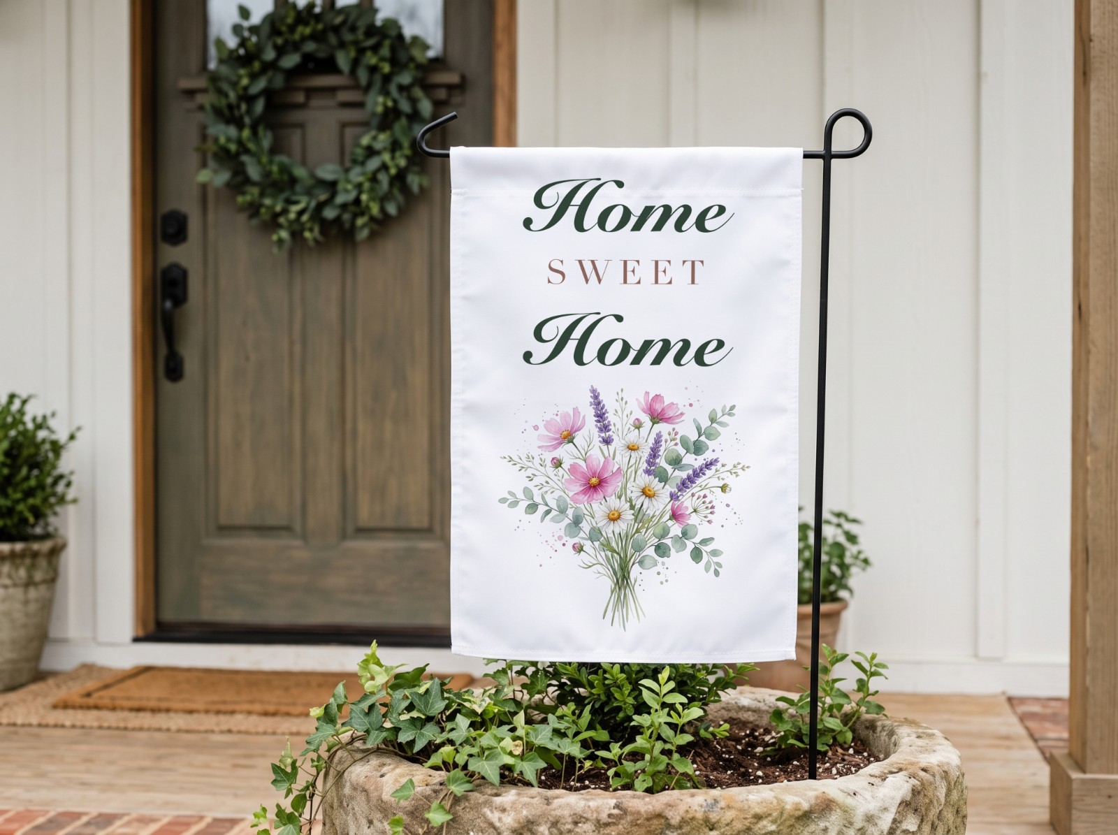 White Garden Flag by a Farmhouse Front Door showing a Home Sweet Home floral sign design