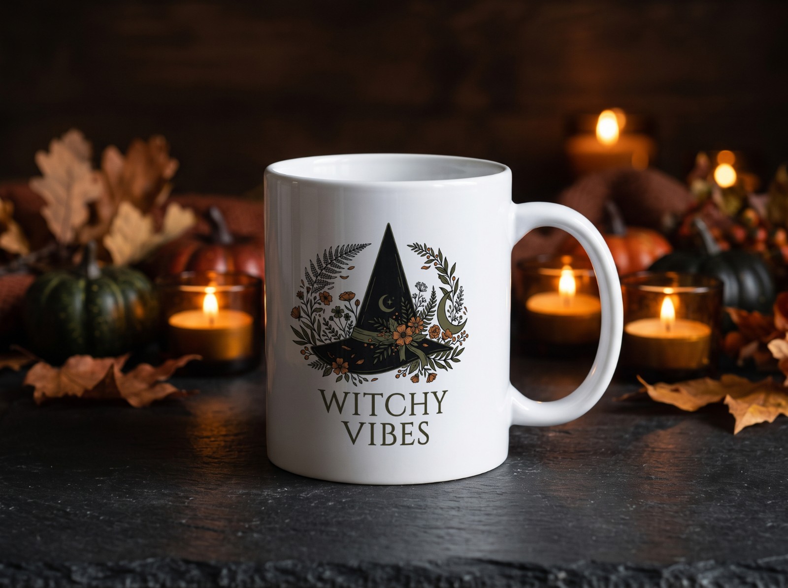 White Halloween Mug with Candles on Dark Slate showing a Witchy Vibes botanical witch hat design