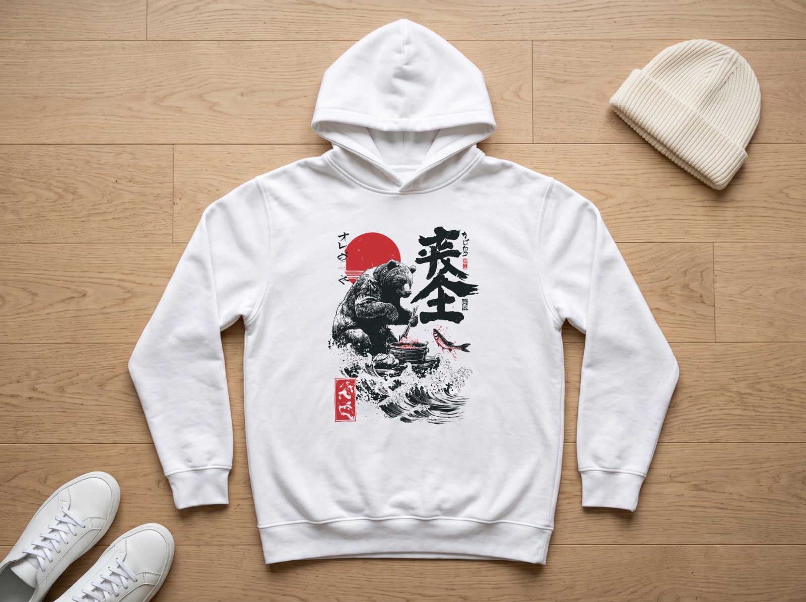 White Hoodie Flat Lay on an Oak Floor showing the Japanese bear design
