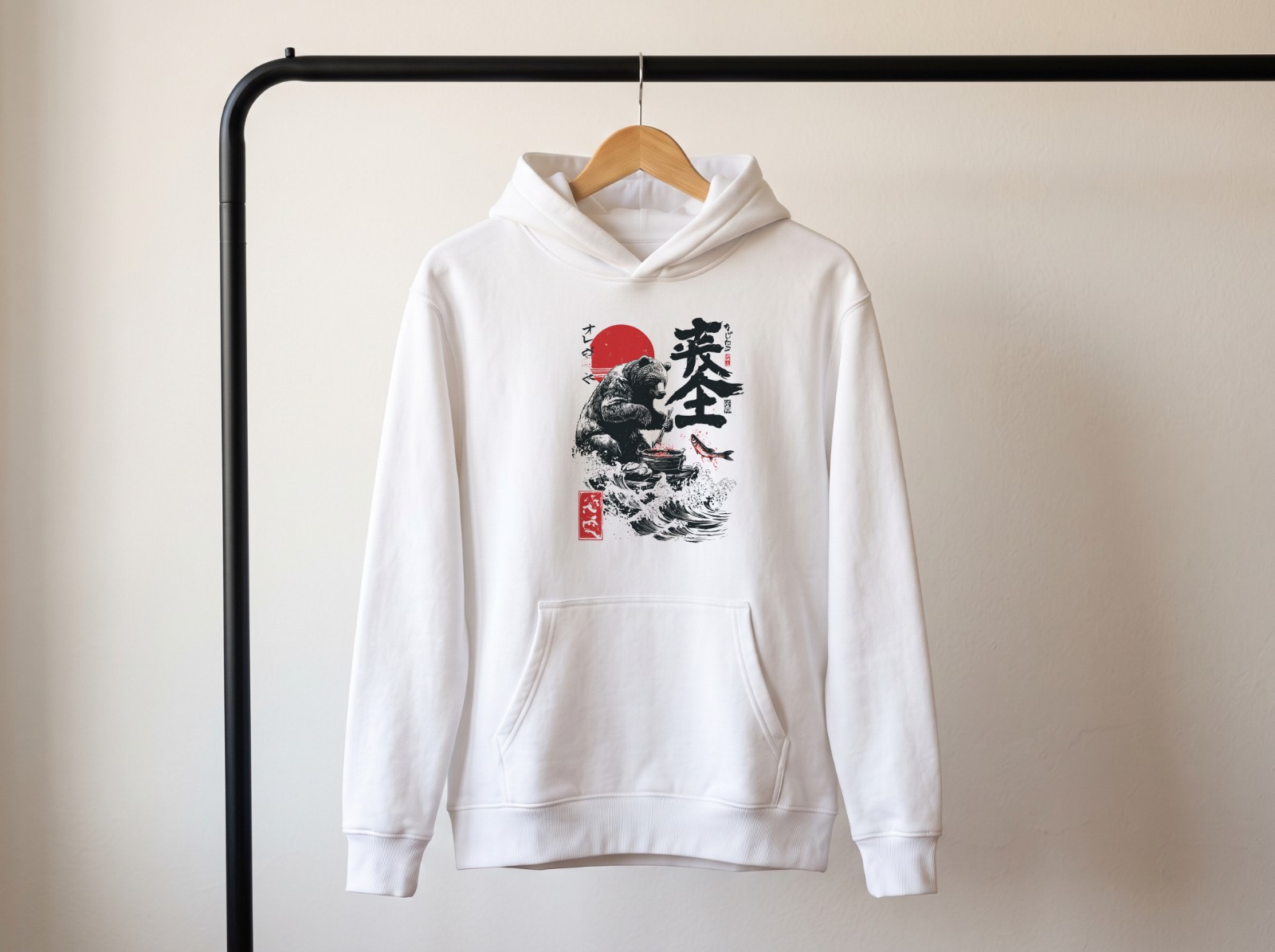 White Hoodie on a Hanger on a Clothing Rail showing the Japanese bear design