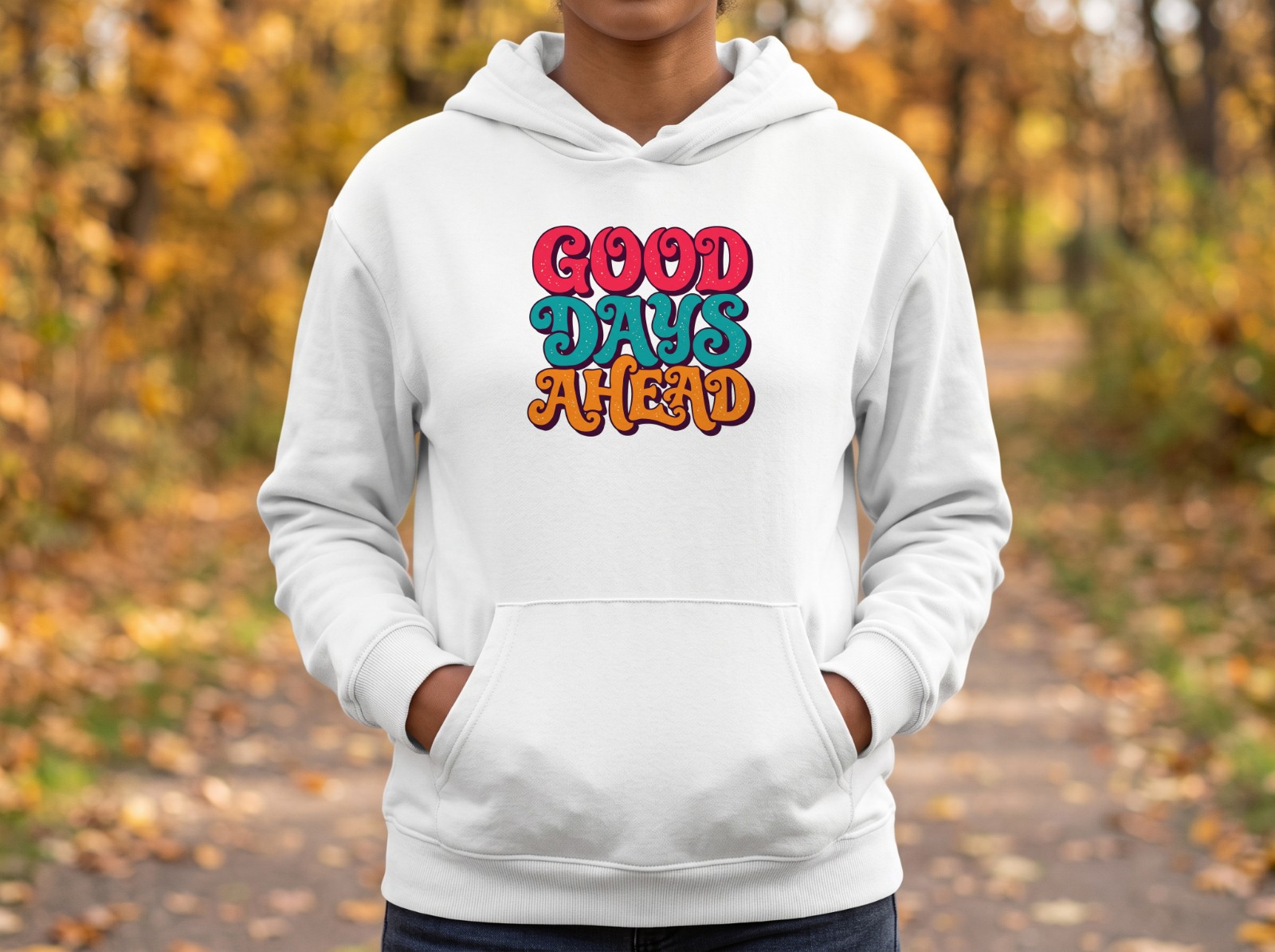White Hoodie on a Woman in an Autumn Park showing a retro Good Days Ahead lettering
