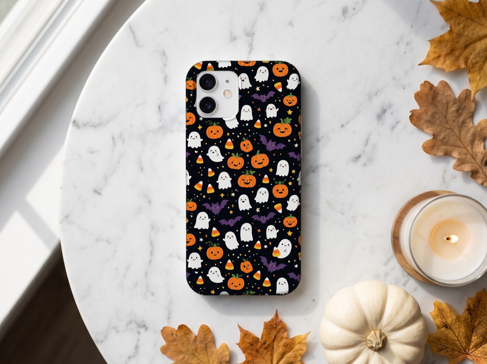 White Phone Case Halloween Mockup on Marble with a Pumpkin and Candle example