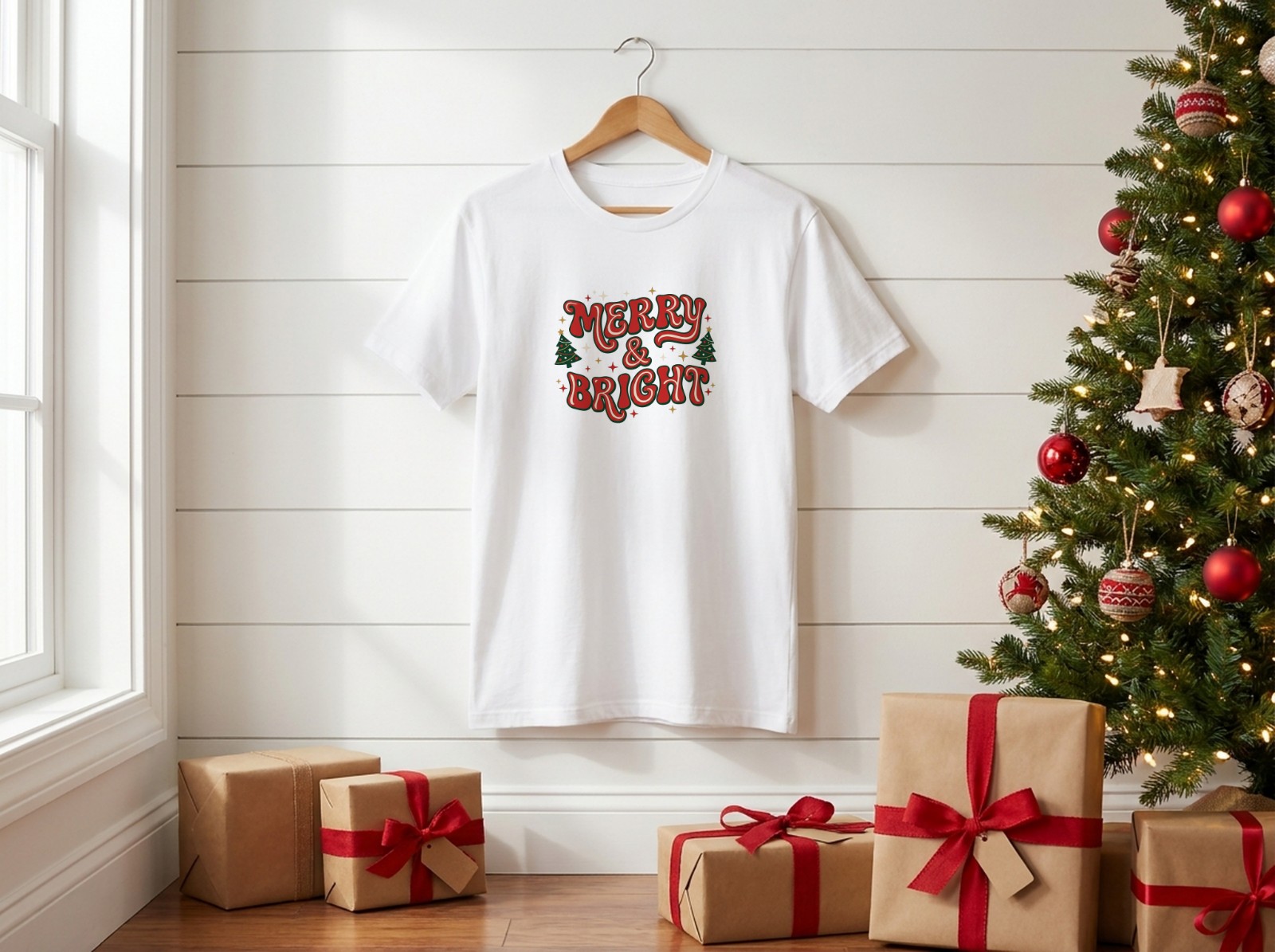 White T-Shirt Christmas on a Hanger by a Christmas Tree showing a retro Merry & Bright design