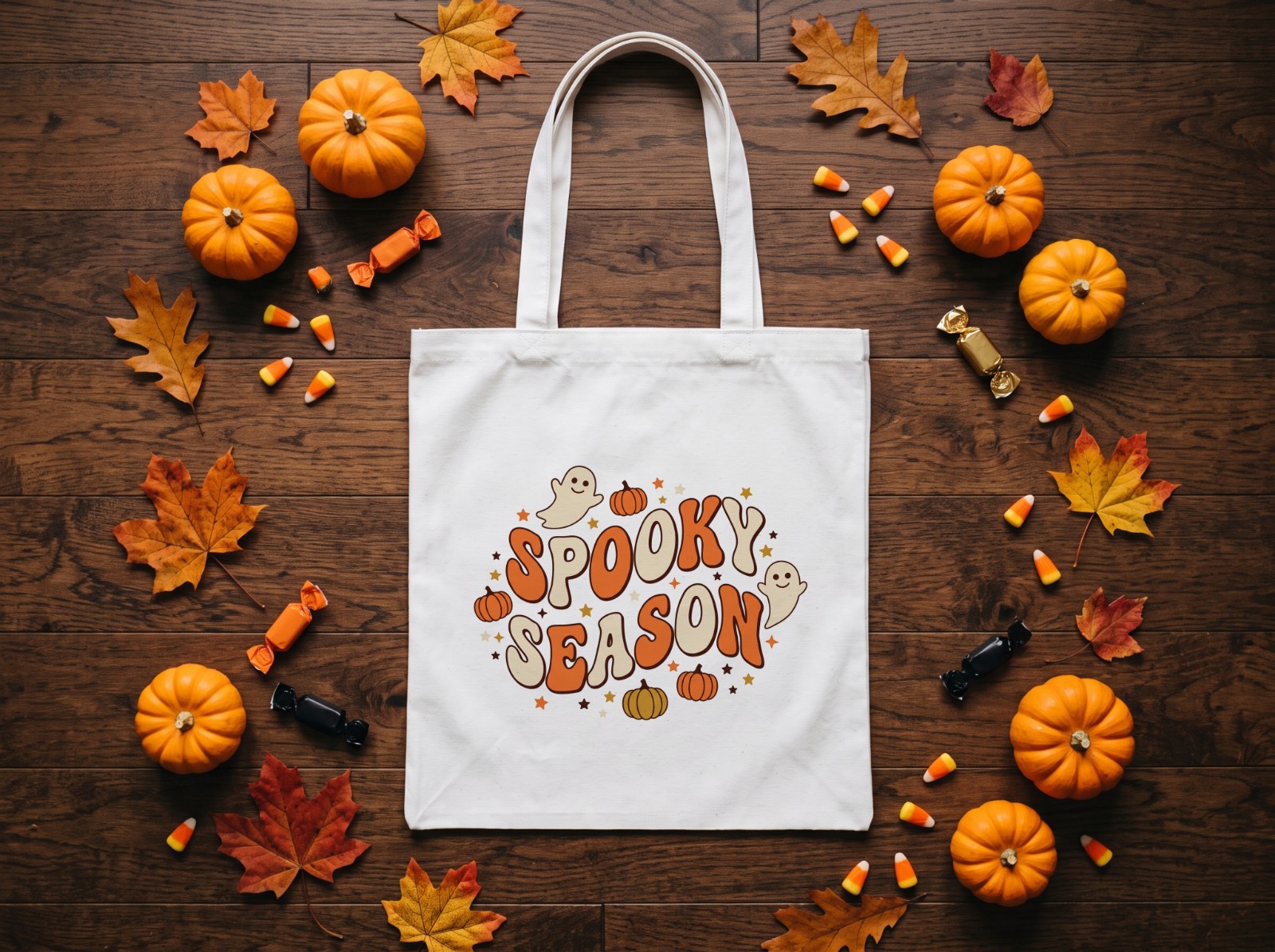 White Trick-or-Treat Tote Bag Halloween with Candy and Pumpkins showing a groovy retro Spooky Season design