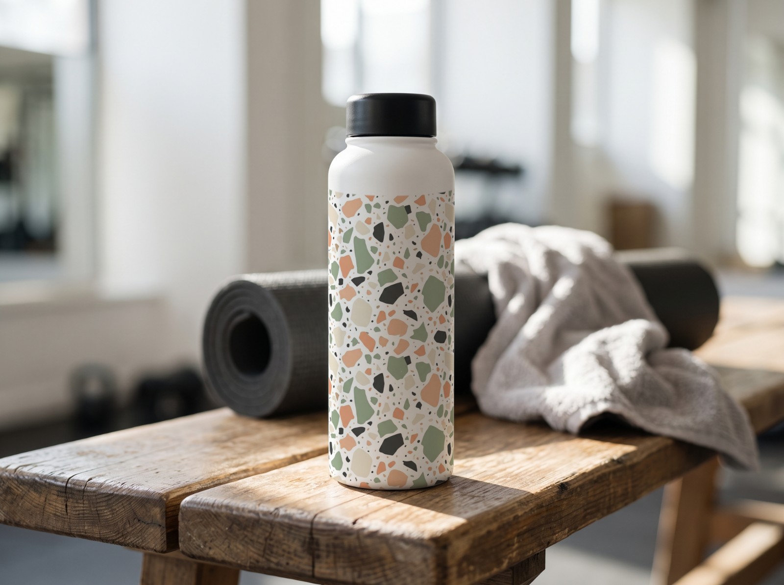 White Water Bottle on a Gym Bench showing a pastel terrazzo pattern