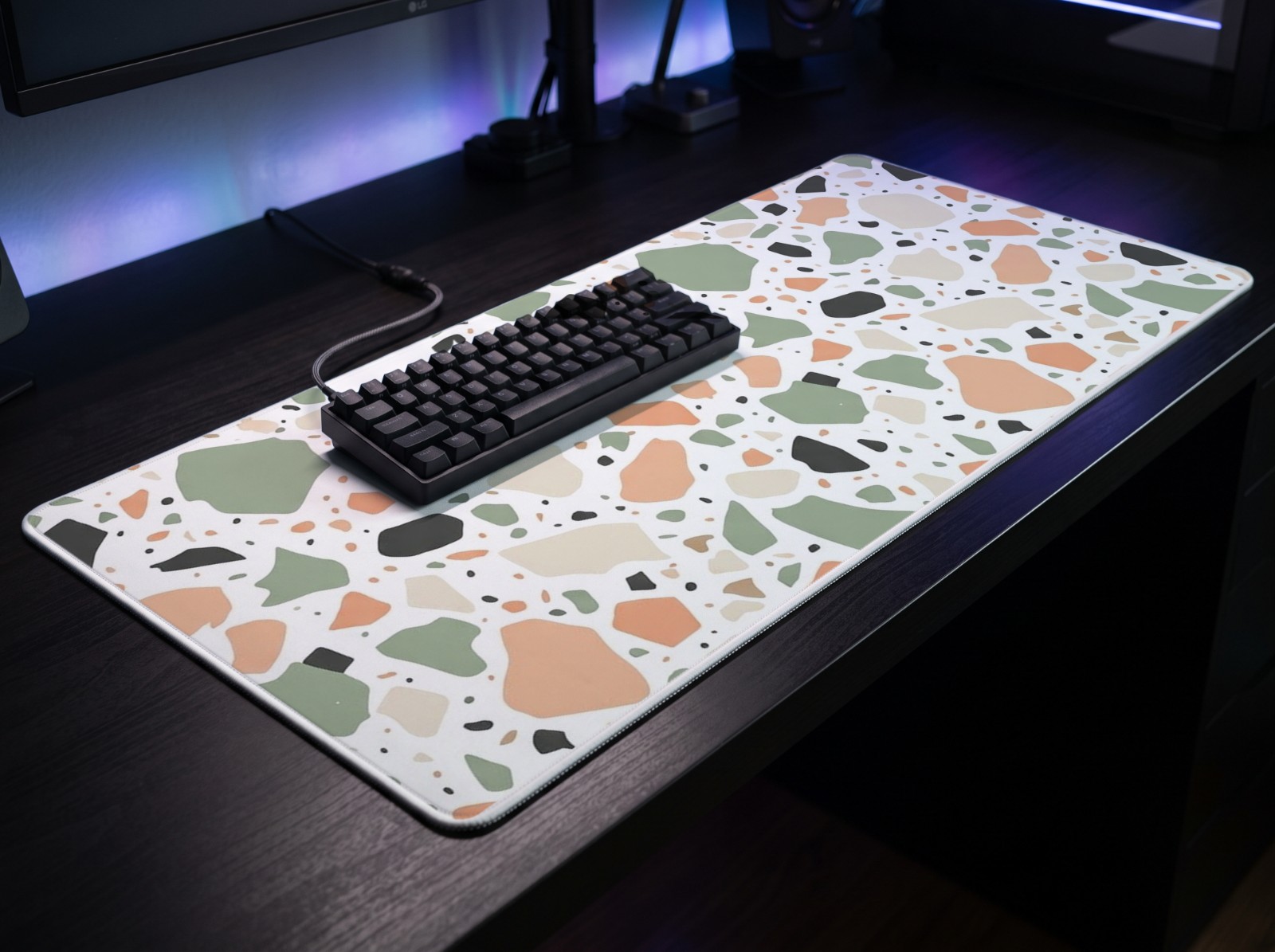 XL Gaming Mouse Pad on a Neon Desk with a Keyboard showing a pastel terrazzo pattern