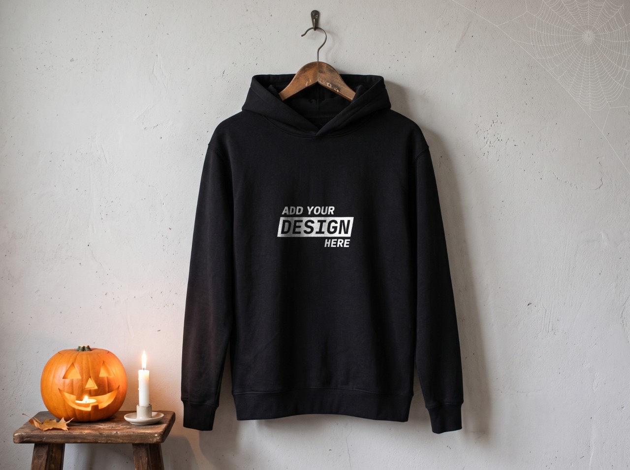 Black Hoodie Halloween Mockup on a Hanger with Cobweb and Jack-o'-Lantern