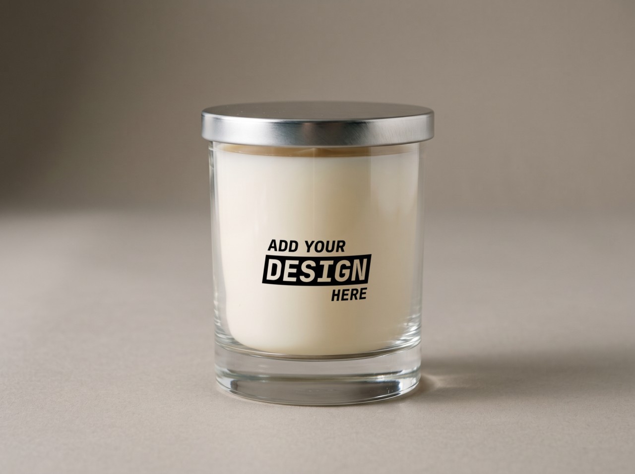 Clear Glass Candle Mockup with a Silver Lid in the Studio