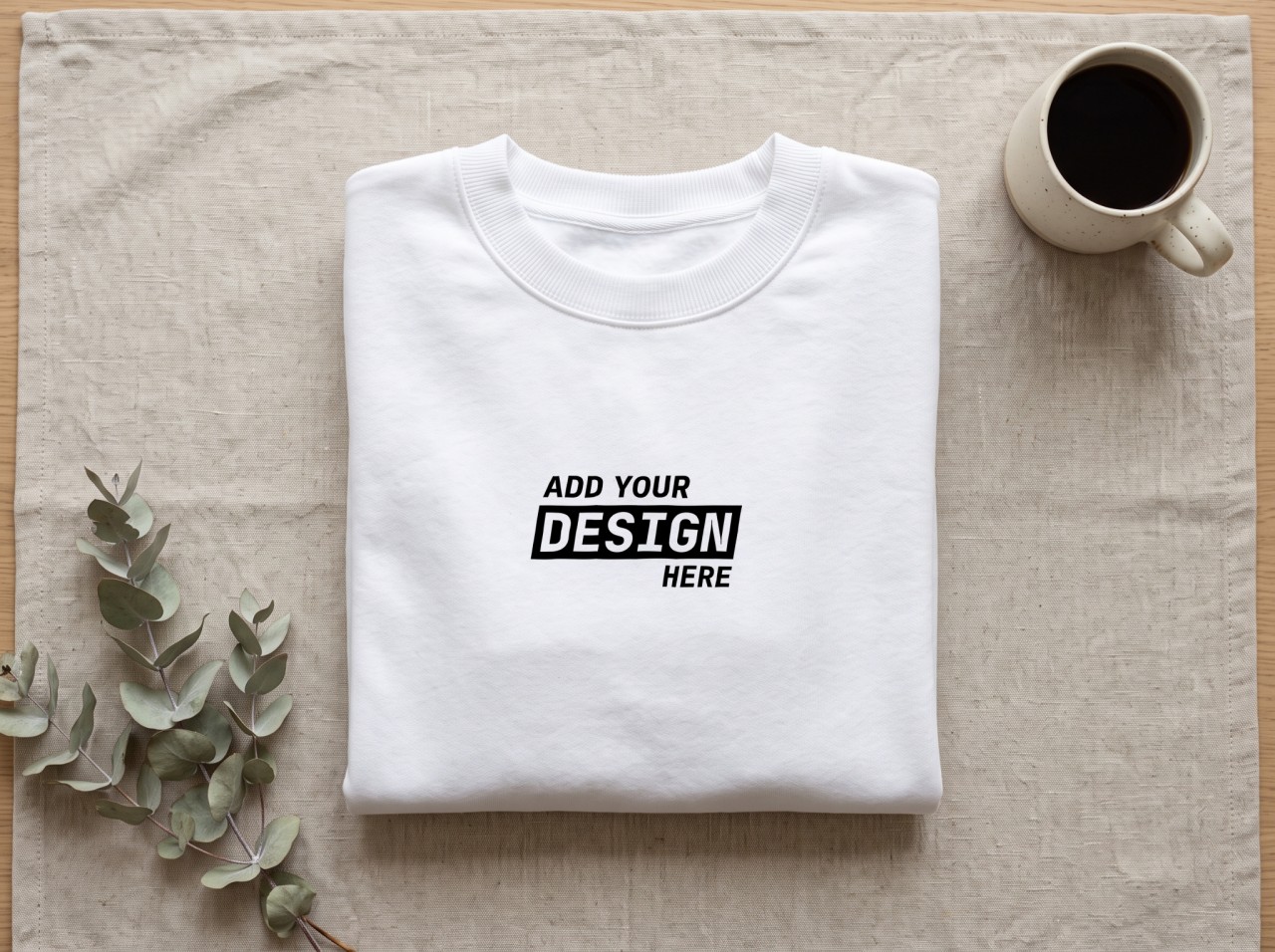 Folded White Sweatshirt Mockup on Linen with Eucalyptus