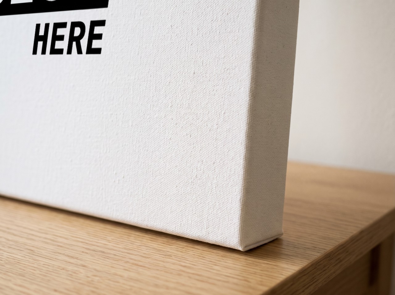 Gallery Wrap Canvas Mockup Corner Close Up with Canvas Texture and a 1.25" Mirror Edge on an Oak Table