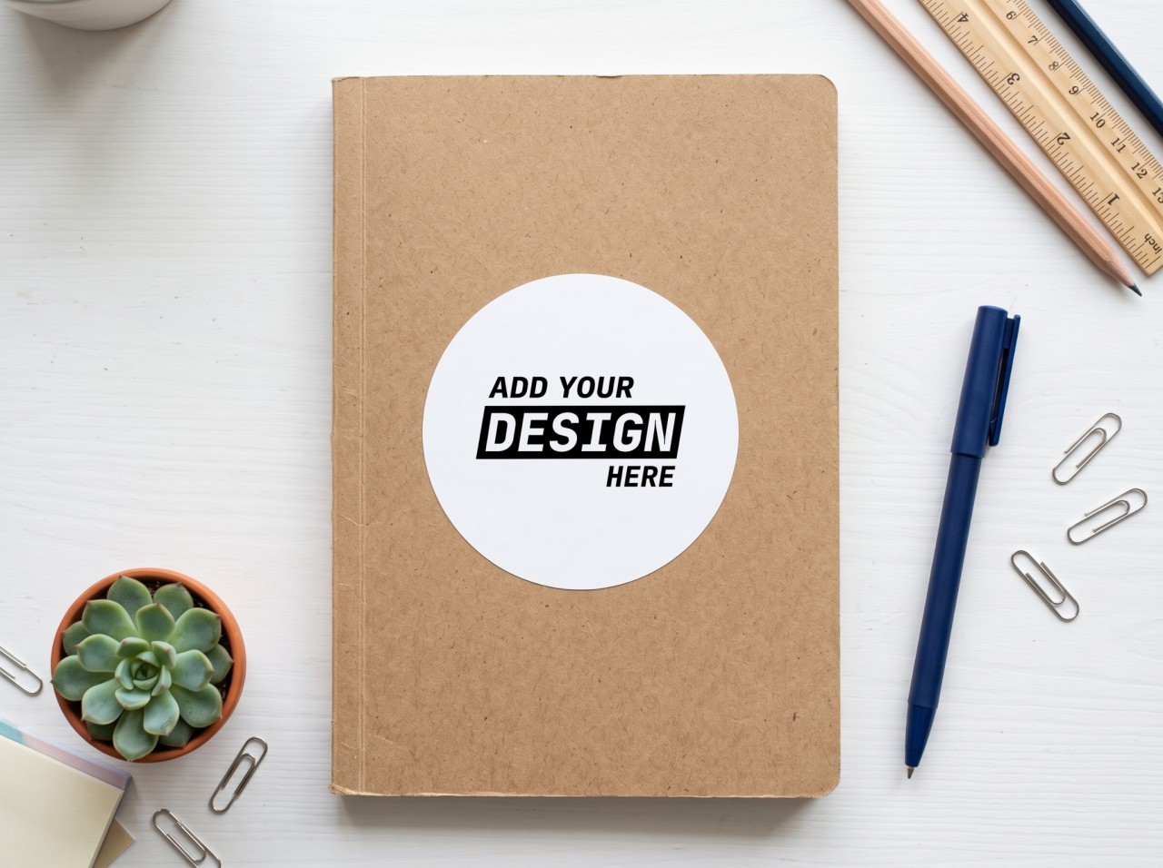 Round Sticker Mockup on a Kraft Notebook
