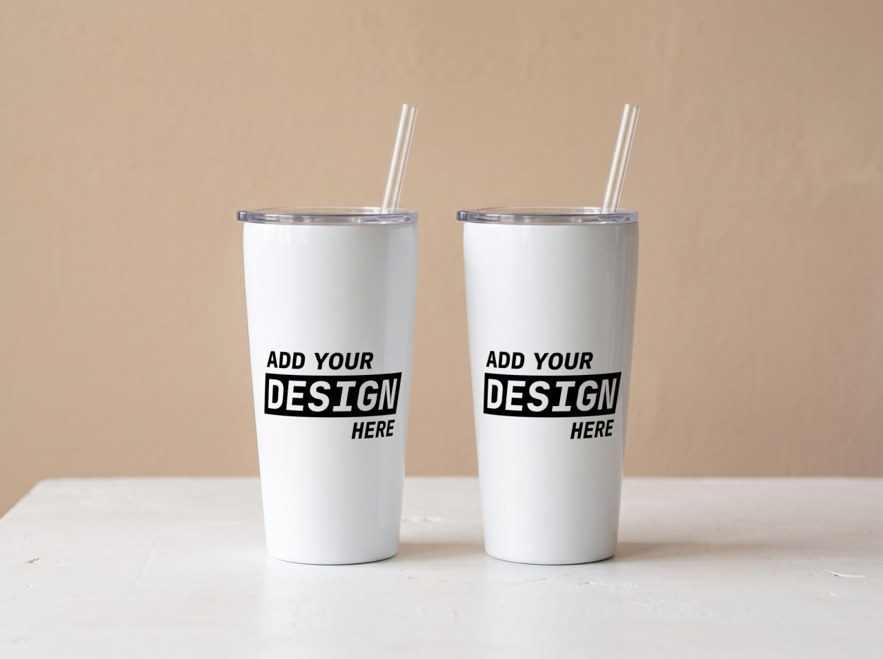 Two Tapered Tumblers Mockup Against a Beige Wall