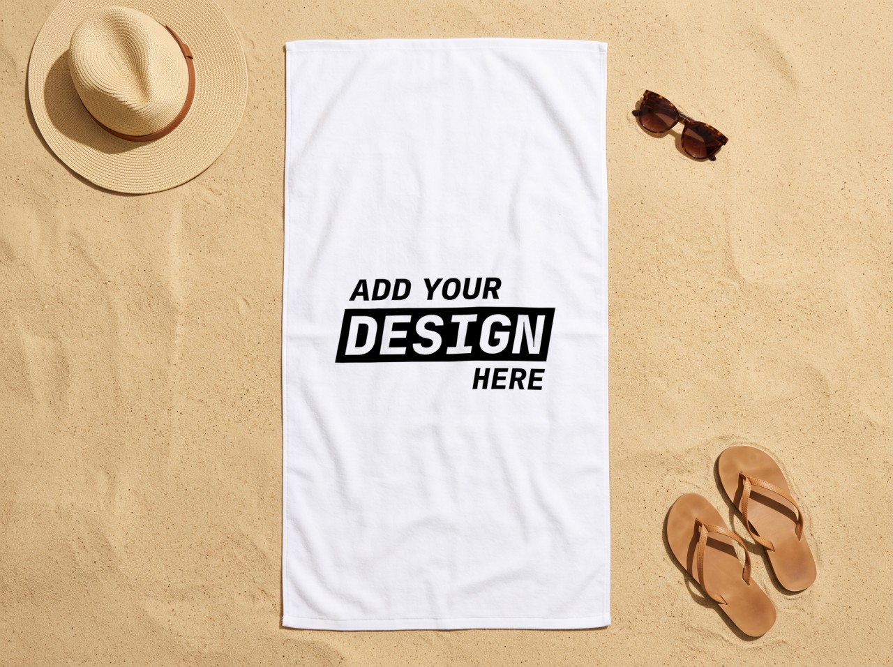 White Beach Towel Mockup on Sand with a Straw Hat