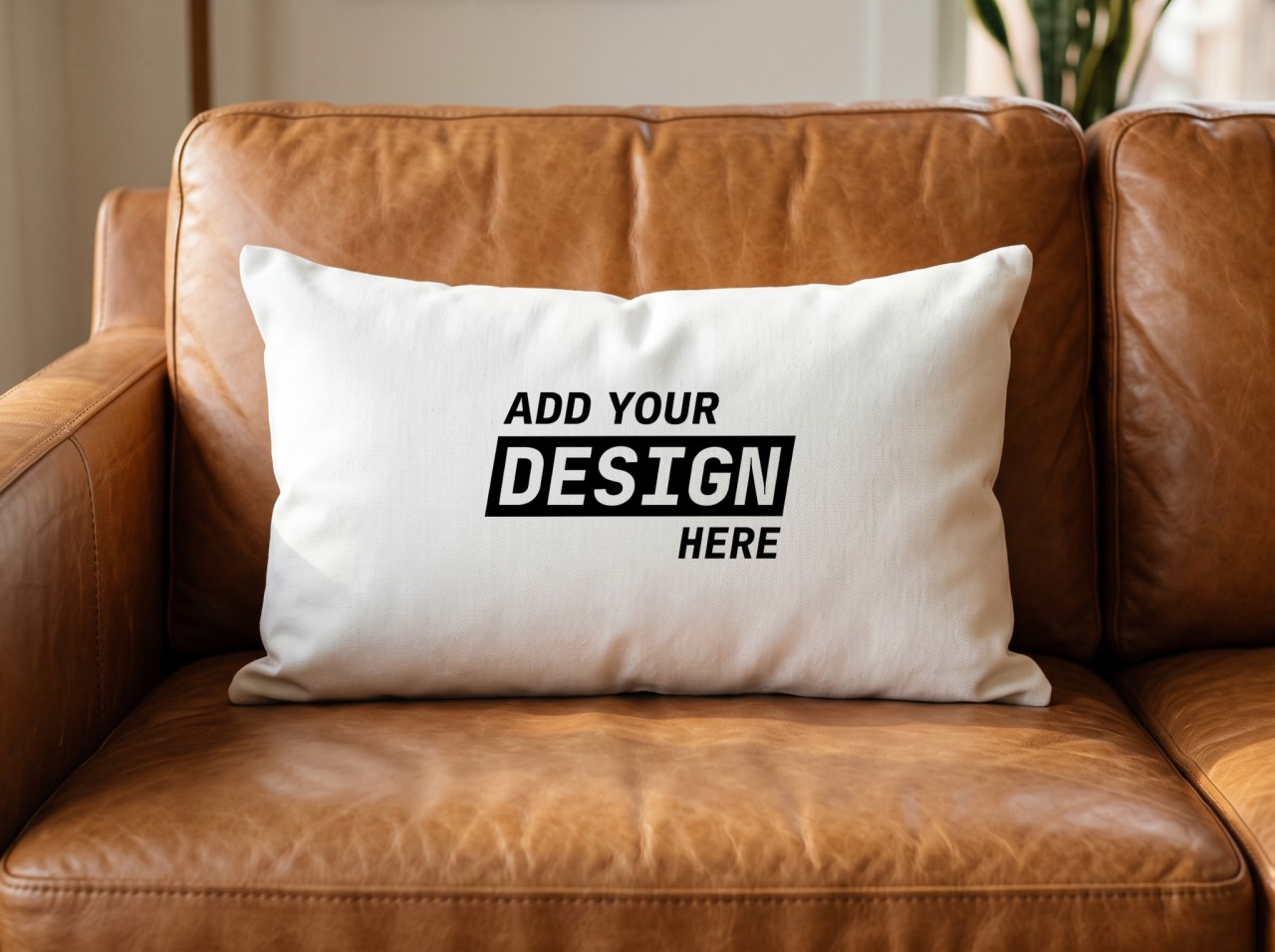 White Lumbar Pillow Mockup on a Leather Sofa in Warm Light
