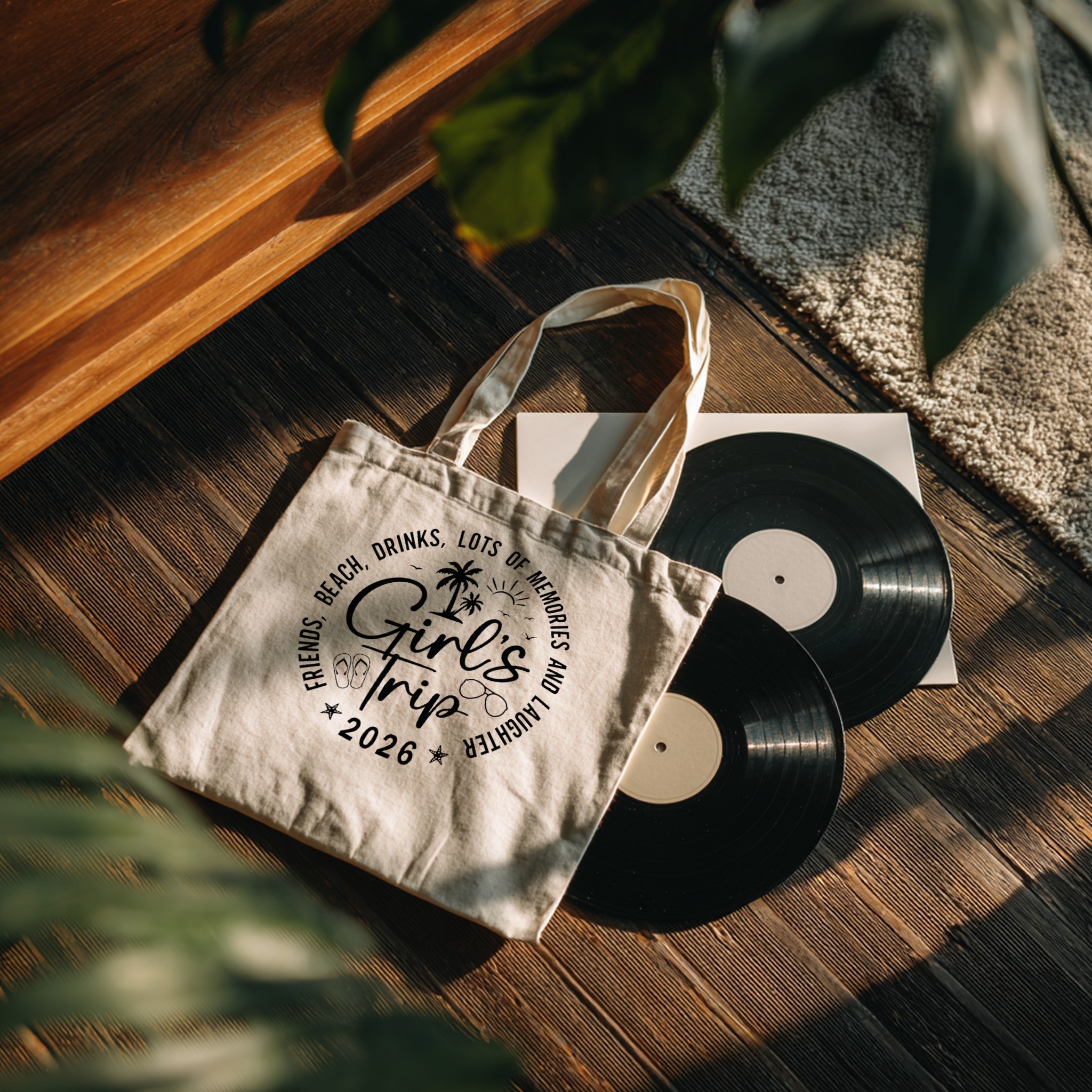Tote bag with custom design on vinyl records flat lay — mockup example