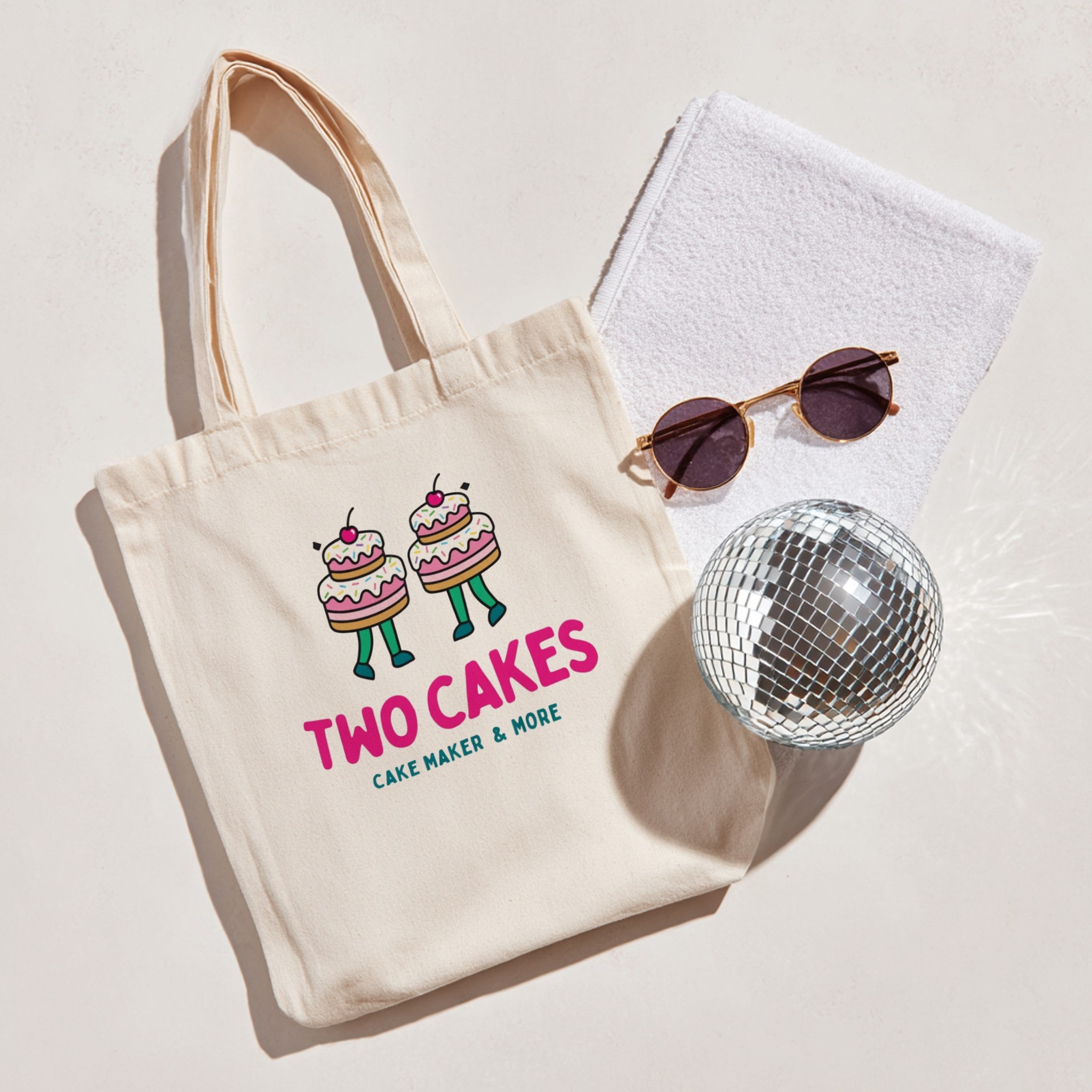 Tote bag with custom design next to disco ball and sunglasses — mockup example