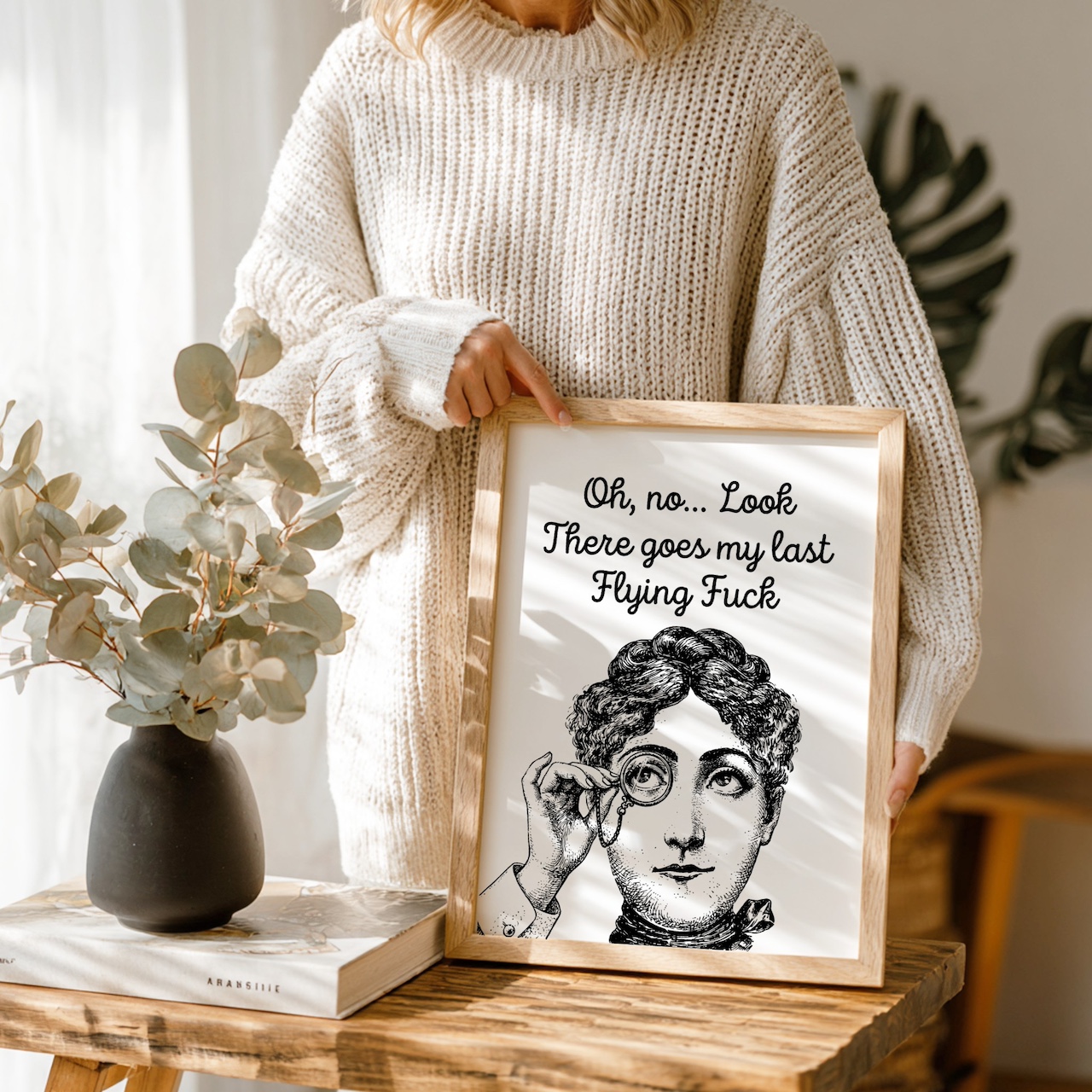 Woman holding oak poster frame with vintage portrait