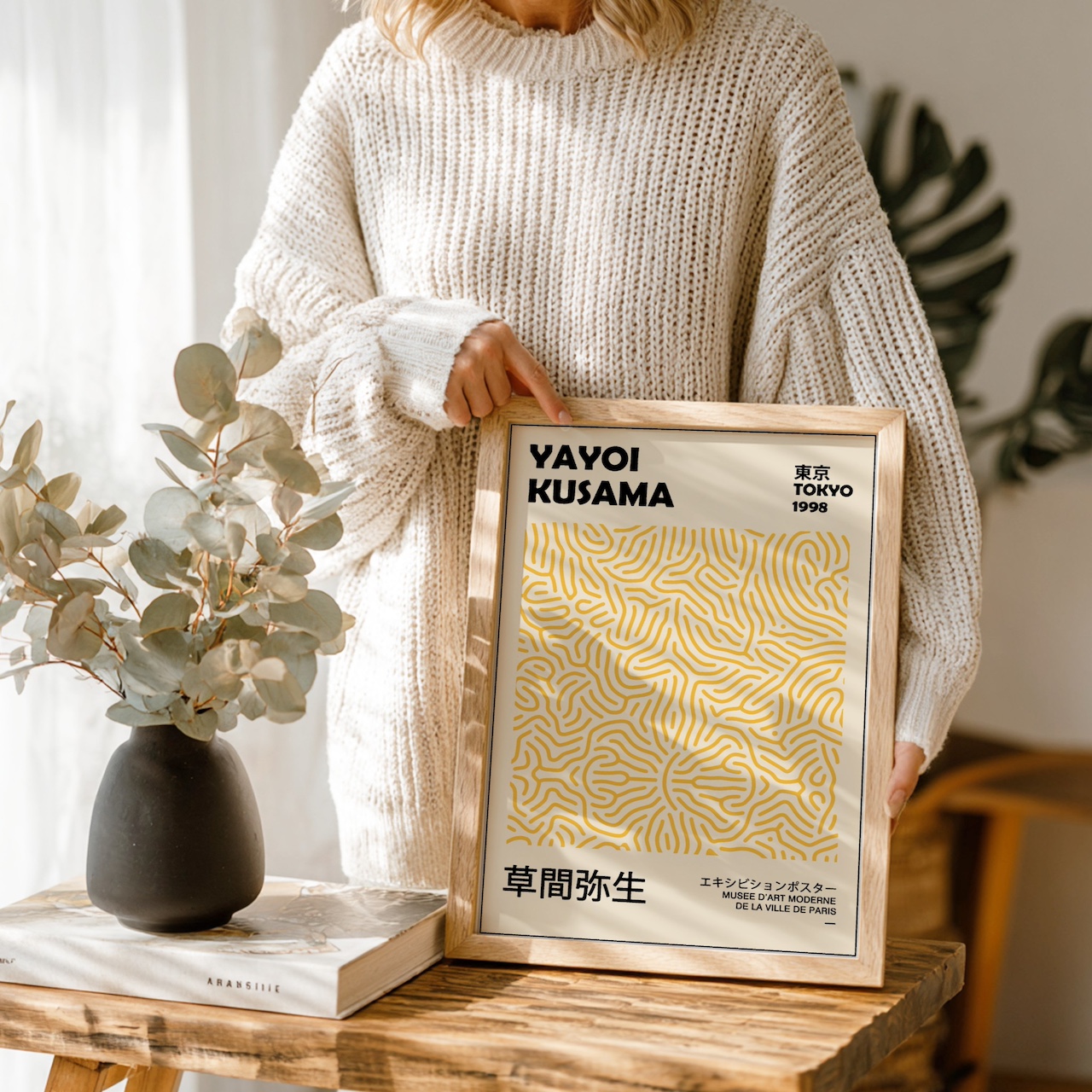 Woman Holding Poster Frame Mockup example